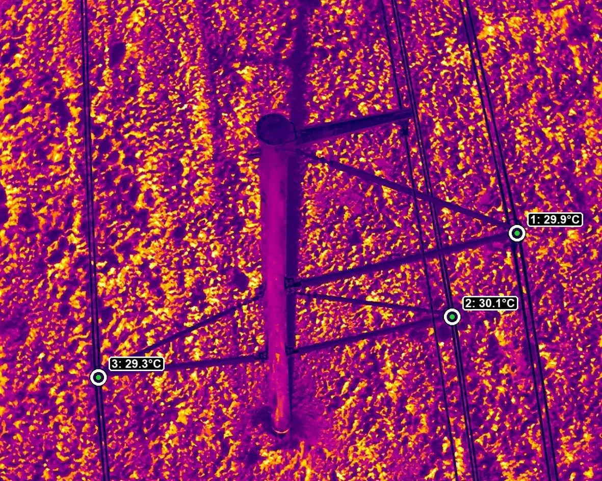 Thermal image of a transmission insulator assembly with six spot-temperature readings marked
