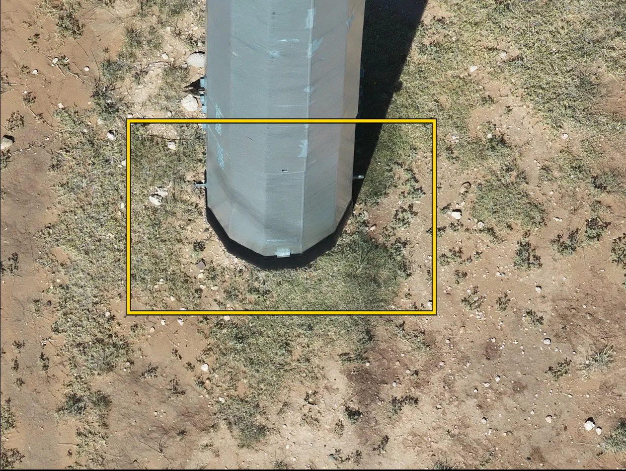 Steel pole base with ground-line area boxed for review