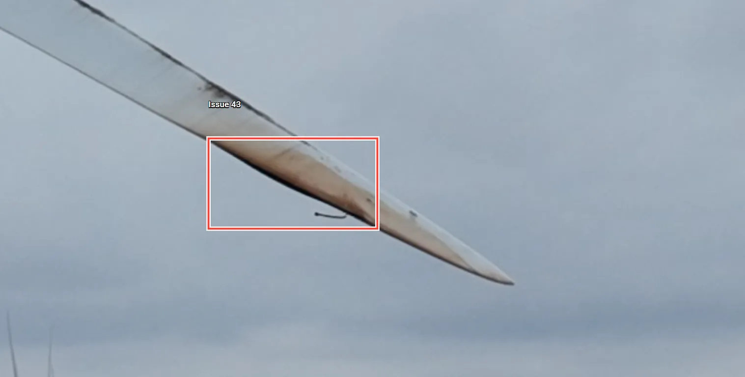 Annotated wind blade image showing a boxed bondline defect near the tip